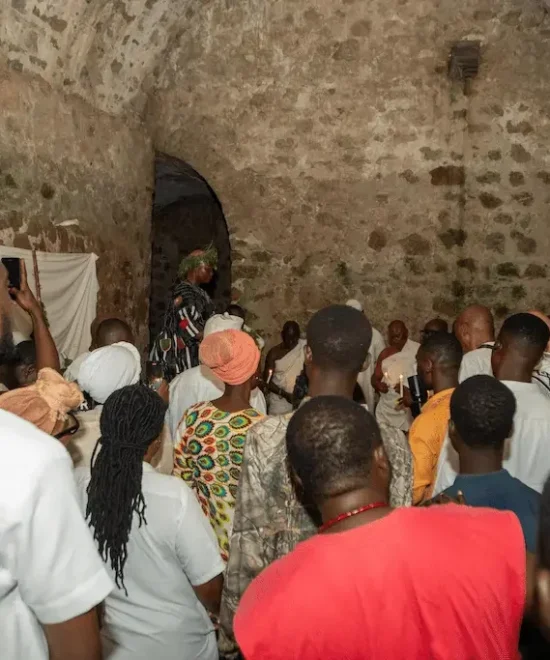 Diaspora visitors walking through the Door of Return